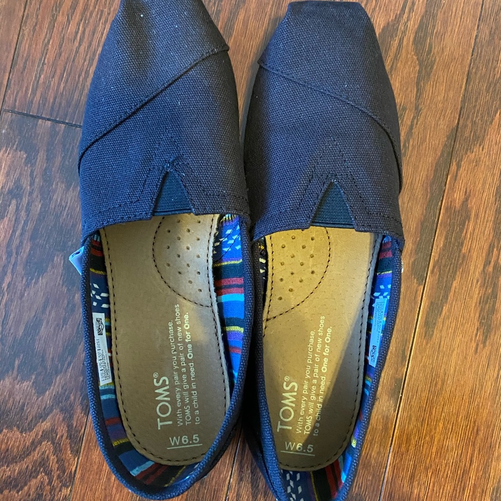 TOMS Black Canvas Slip-ons